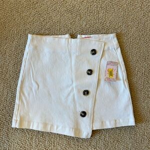 white denim skirt, asymmetrical front with buttons